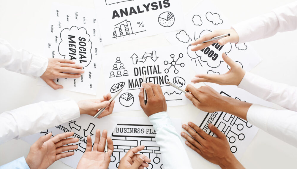 Offer new ideas Business team discussing digital marketing ideas by dragonimages